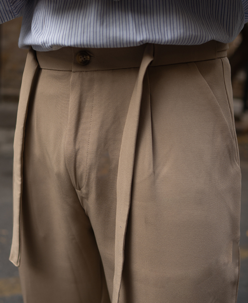 beige-pleated-trousers-with-belt